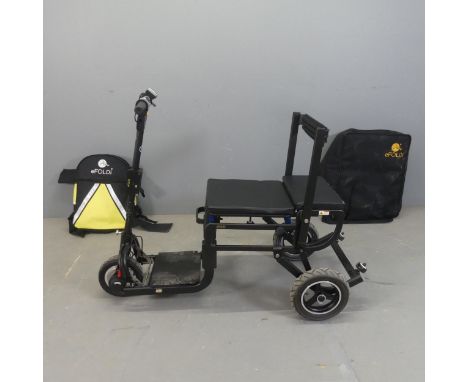 An eFoldi Lite powered folding scooter, with storage bag and backpack.We cannot test electrical goods, but this appears to be