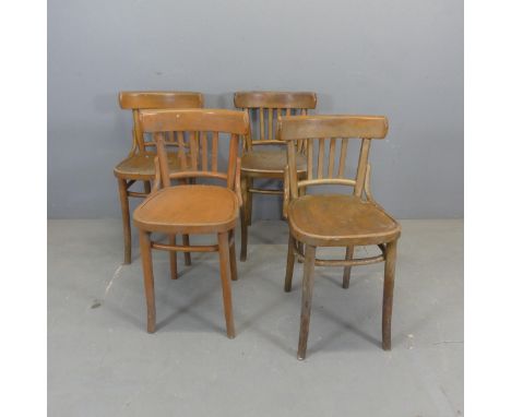 A set of four vintage bentwood bistro chairs, with indistinct impressed maker's marks and remains of paper lables.