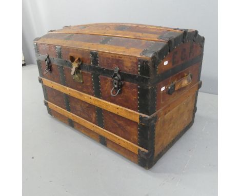 A Victorian leather covered dome-top trunk with tooled and embossed decoration, marked E.C.F. Width 82cm, height 56cm, depth 