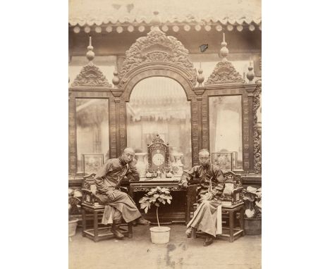 China. Two Chinese men seated in front of a large mirror, Peking, c. 1890s, albumen print with card backing, 19.5 x 14 cmQTY: