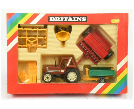 Britains 9591 Fiat Tractor and Implement Set - red tractor, light cream wheels with green/yellow trailer with various other a