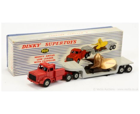 Dinky 986 Mighty Antar Low Loader with Propeller load - red tractor unit with blue driver figure, black grille, grey Supertoy