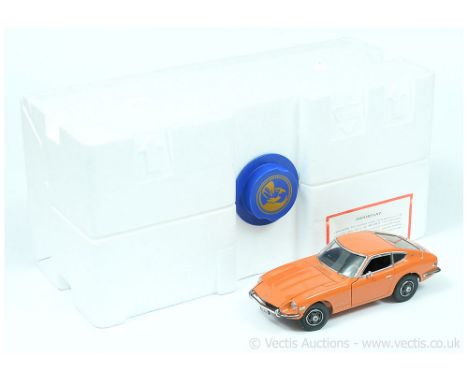 Franklin Mint 1/24th scale The Datsun 240Z - orange, black interior, chrome trim with accessory tool, paperwork and inner pac