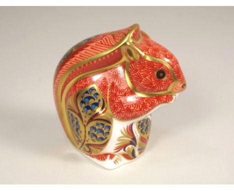 ROYAL CROWN DERBY. A Royal Crown Derby squirrel paperweight, with gold button. Height 9cm.