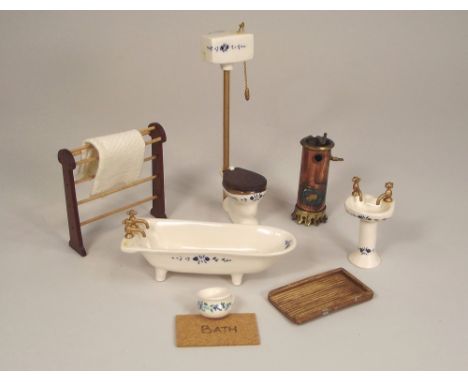 DOLL'S HOUSE FURNITURE. A doll's house ceramic bathroom suite with accessories.