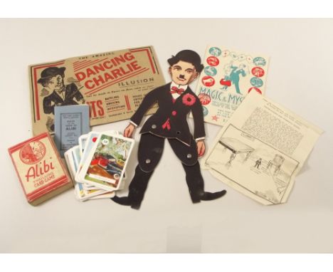 CHILDREN'S GAMES.A Dancing Charlie printed cardboard figure with original pack with instructions, a Magic & Mystery booklet &