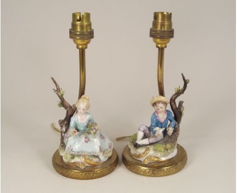 CAPODIMONTE. A pair of Capodimonte figural lamp bases. Height 20cm.