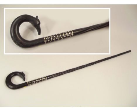 WALKING STICK. A bone inlaid ebony walking stick with bird's head handle, possibly African.