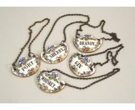 SPIRIT LABELS. A set of five Crown Staffordshire ceramic spirit labels, retailed by T Goode &amp; Co., Ltd., London.