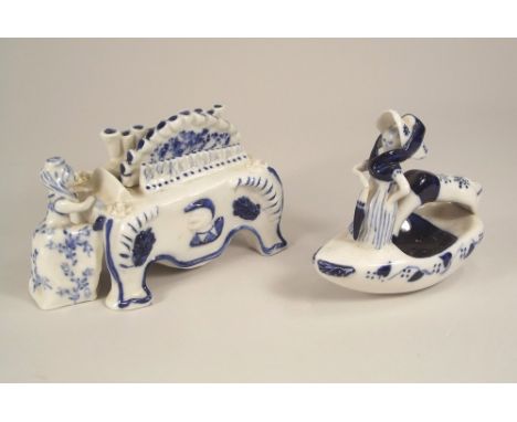 WILFRED GIBSON. A Wilfred Gibson, Falmouth, lady playing a pipe organ, painted mark &amp; No.26m, length 14cm, &amp; a rockin