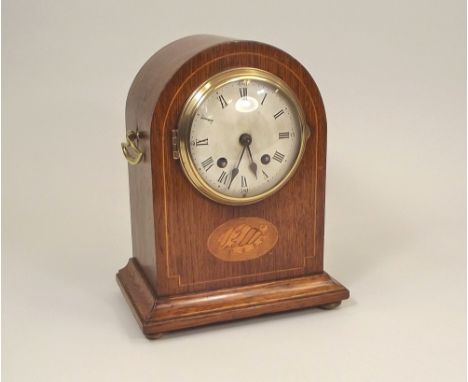 MANTLE CLOCK. An Edwardian oak mantle clock with shell marquetry inlay. Height 26cm.