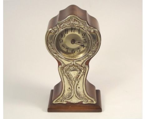 ART NOUVEAU MANTEL CLOCK. A walnut cased mantel clock, with Art Nouveau EPNS mount. Height 24cm.
