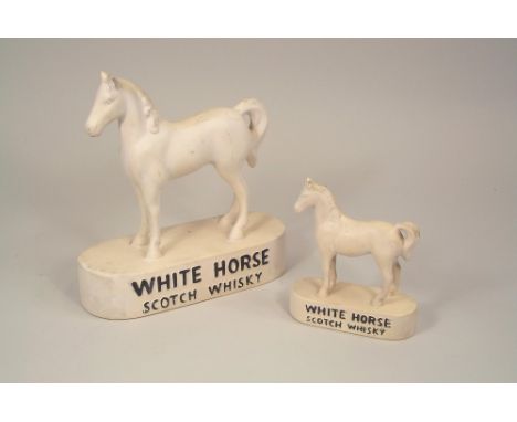 ADVERTISING MODELS. Two pottery White Horse Scotch Whisky advertising models. Largest 22cm.