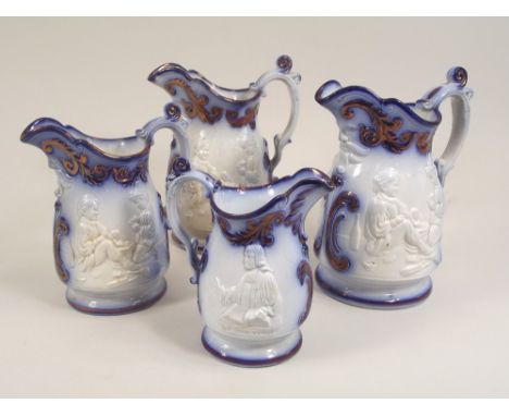 VICTORIAN JUGS.A set of three Victorian flow blue & copper lustre graduated jugs, moulded with children playing, tallest 20cm