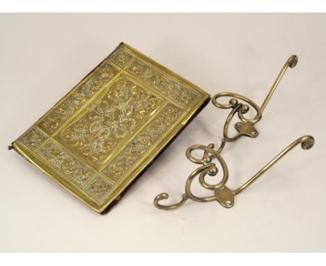 BRASS WARE. An Art Nouveau brass mounted blotter, 23 x 17cm &amp; a pair of coat hooks.