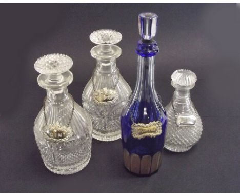 DECANTERS.A pair of Victorian cut glass decanters, a similar small decanter & a blue flash cut decanter (stopper repaired). T