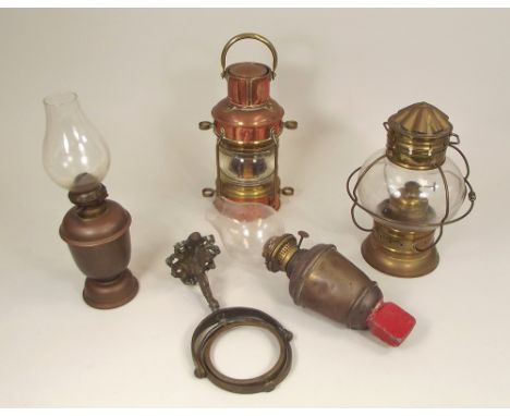 SHIP'S LAMPS ETC.A gimbal oil lamp on dolphin support, two ships lamps & a weighted copper oil lamp.