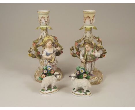 SITZENDORF ETC.A pair of mid 19th century Sitzendorf figural candlesticks, height 19cm, blue mark to base & a pair of 19th ce