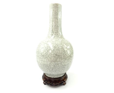 19th century Chinese crackled glazed celadon vase (once converted into a lamp) raised on carved wooden base, 35cm h