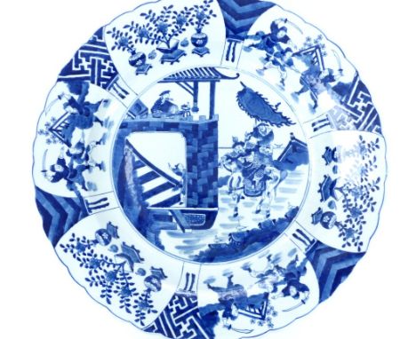 Chinese blue and white porcelain charger, decorated with battle scene to centre within floral cartouches, bears Kangxi mark t