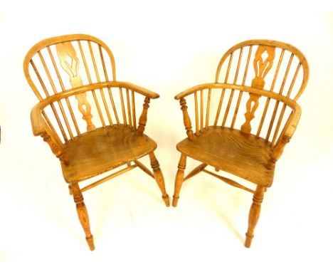 Pair of late 19th century elm comb back elbow chairs, vase splat, turned supports and legs, saddle seat (2)