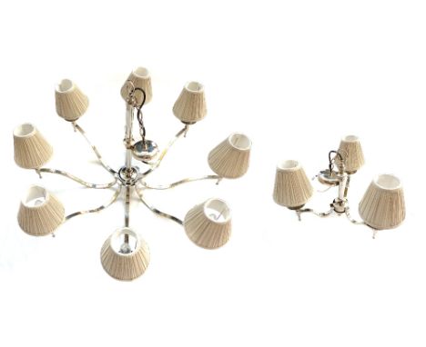 Contemporary chrome plated eight branch ceiling light, with flattened shaped arms terminating in sconces with ruched putty co