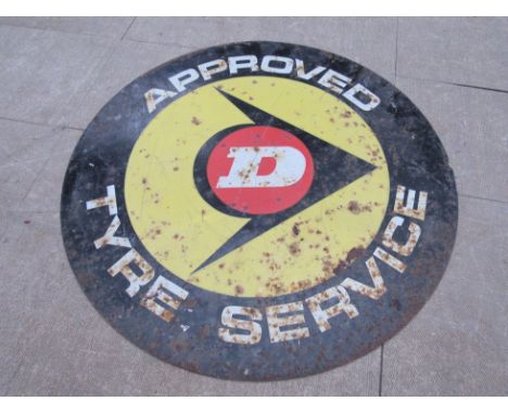 A circular double sided 'Approved Dunlop tyre service' sign. 56cm diameter.