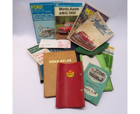 A box of mixed manuals etc including Austin A30, Morris and Ford. A 1970 road atlas and a service manual for Austin A30/A35 p