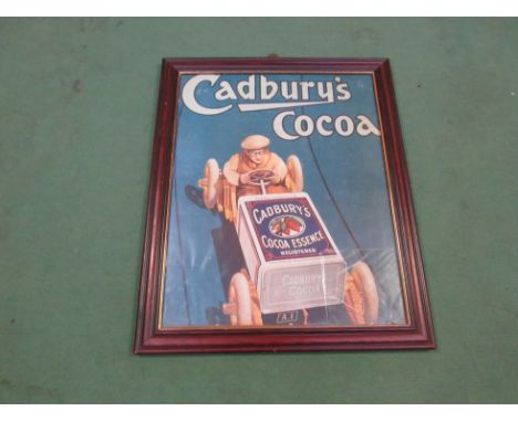 A reproduction framed and glazed 'Cadbury's Cocoa' print depicting a vintage racing car. 48cm x 58cm