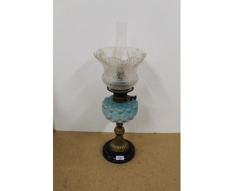A Victorian brass oil lamp with a turquoise glass reservoir and etched shade (converted)