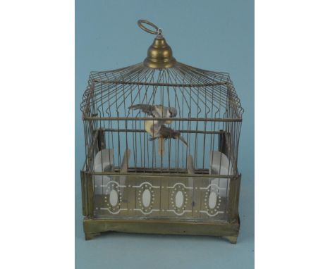 A small mid century brass finish bird cage with ceramic feeders, approx 39cm tall 