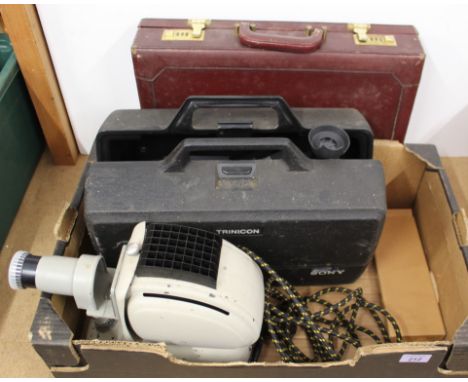 A vintage Noris slide projector, a Sony Trinicon video camera with case, a leather attaché case containing a Fujica cine came
