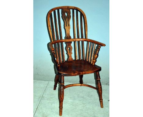 A 19th century Ash and Elm stick back Windsor Armchair with Crinoline Stretcher, pierced central splat, turned supports to ar