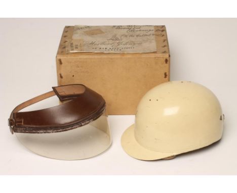 A HERBERT JOHNSON VINTAGE MOTORCYCLE HELMET (1936-1952), the cork and foam lined cream painted peaked helmet with canvas neck