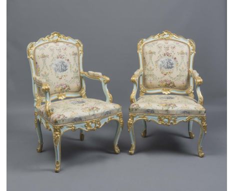 A PAIR OF LOUIS XV PAINTED AND PARCEL GILT BEECH FAUTEUILS A LA REINE, c.1760, carved with foliate scrolls, shells and rocail