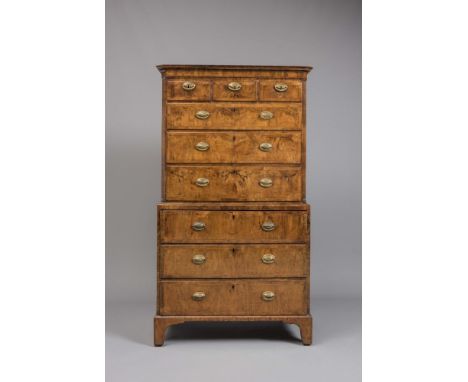 A GEORGIAN WALNUT SECRETAIRE CHEST ON CHEST, mid 18th century, the cavetto moulded cornice over three short and three long dr