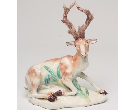 A DERBY PORCELAIN STAG, c.1770, modelled at lodge with an outstretched left front leg on a grass moulded shaped base, patch m