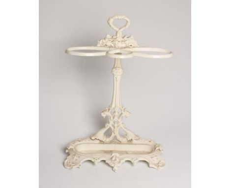 A VICTORIAN CAST IRON STICK STAND of oval outline, the waisted back moulded with foliage and with loop handle surmount, entwi