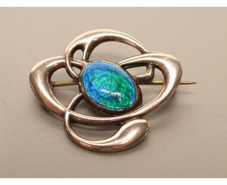 AN EDWARDIAN ARTS AND CRAFTS SILVER AND ENAMEL BROOCH, maker Charles Horner, Chester, probably 1907, the open Celtic knot typ