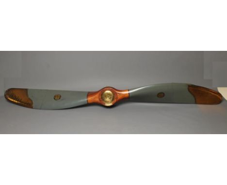 A LARGE WW1 PROPELLOR of wood construction, painted in naval grey, bearing transfer and stamps for Parnall &amp; Sons, brass 