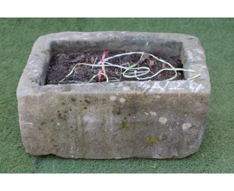 A SANDSTONE TROUGH of finely cut oblong form, 22 1/2" x 15" x 10 1/2" (Est. plus 21% premium inc. VAT)