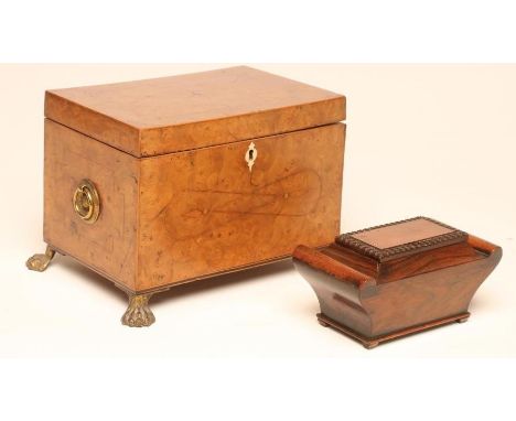 A YEW WOOD VENEERED TEA CADDY, early 19th century, of oblong form with decorative ebony and boxwood stringing, the hinged lid