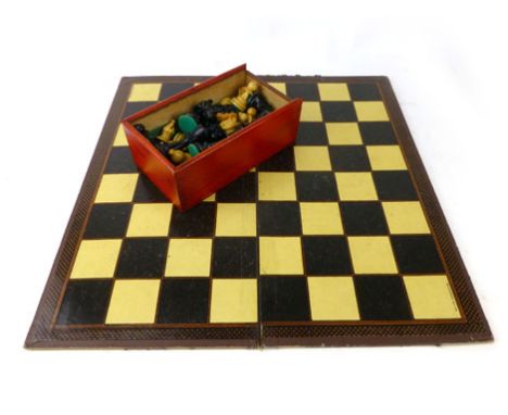 A Staunton style turned wooden chess set, ebonised and natural wood together with a Chad Valley chess and draught board CONDI