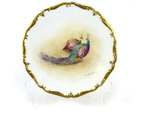 An English porcelain cabinet plate decorated by Christopher Hughes (Royal Worcester artist) of a peacock and a peahen inside 
