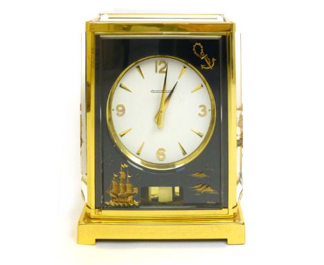 A Jaeger-Lecoultre Marina Atmos clock, the white dial with gilt numerals and batons, surrounded by an anchor, sailing ship an