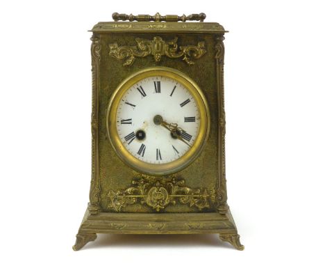 A French late 19th century brass cased mantle clock, circular enamelled dial on a striking eight day movement, the case with 