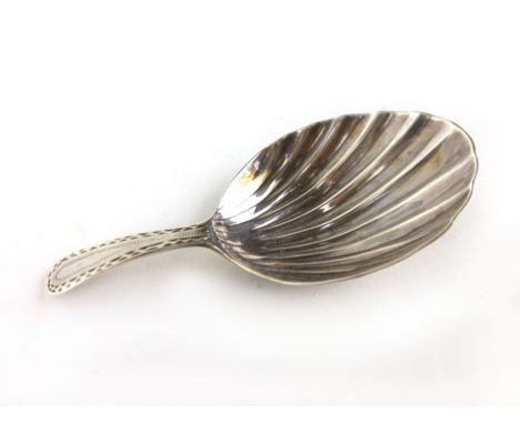 A George III silver caddy spoon with bright cut decoration to handle, makers mark RC other marks rubbed, total weight 7g appr