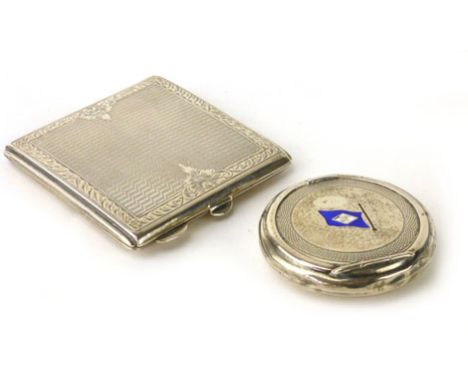 A George V silver and enameled compact of circular form enameled with flag and initialed AH together with another white metal