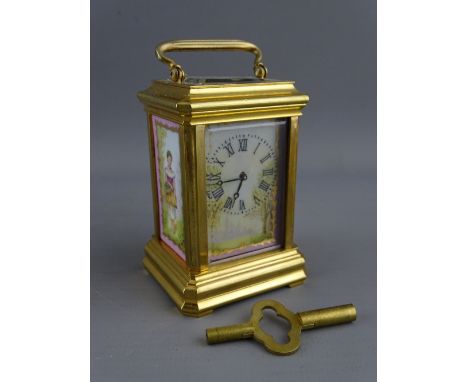 A FRENCH MINIATURE BRASS & PORCELAIN ENAMEL CARRIAGE CLOCK set with Roman numerals, the movement backplate numbered 3008, 9 c