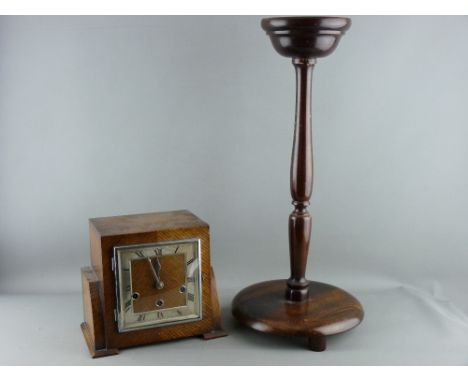 AN OAK CASED ART DECO MANTEL CLOCK with a wooden smoker's stand